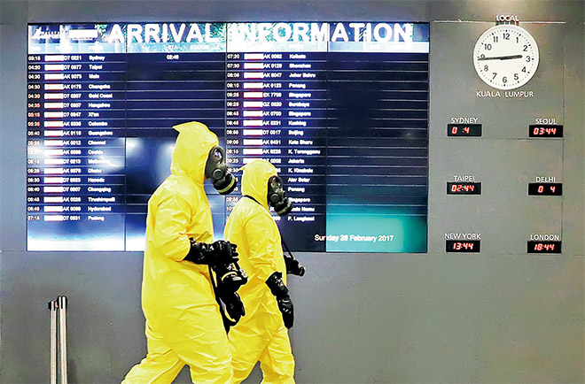  Anggota pasukan Hazmat menjalankan pemeriksaan di terminal KLIA2 di Sepang, semalam. — Gambar Reuters