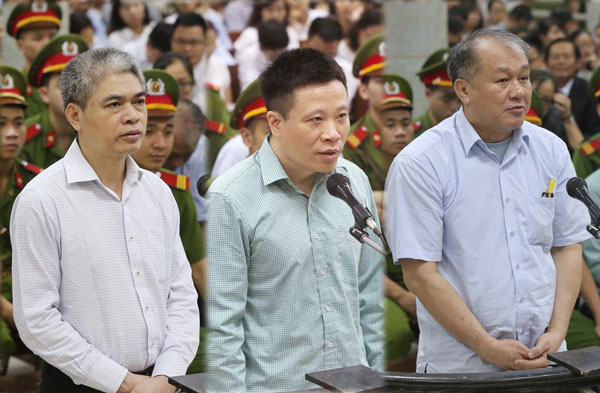  Kombinasi gambar menunjukkan (dari kiri) Nguyen Xuan Son, Ha Van Tham dan Pham Chong Danh dalam perbicaraan di Mahkamah Rakyat di Hanoi, semalam. — Gambar AFP