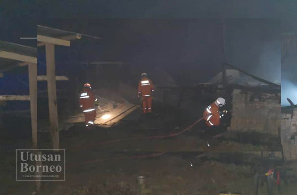 ANGGOTA bomba sedang memadamkan api yang memusnahkan sebuah rumah di Kg Mangi Pangi Tambunan.