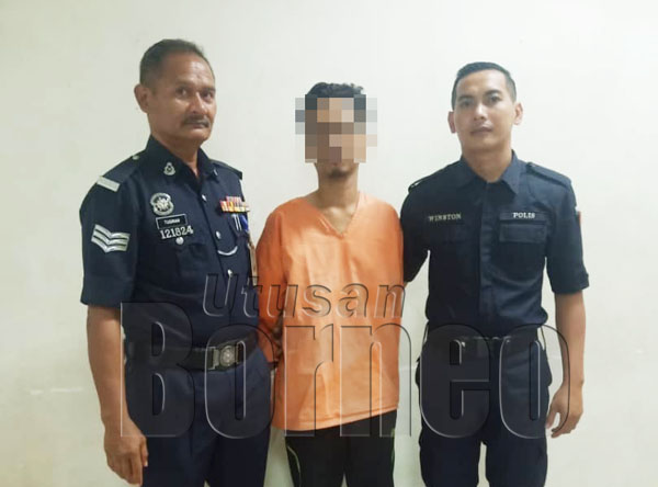  Ammy diiringi dua anggota polis selepas perbicaraan kes.