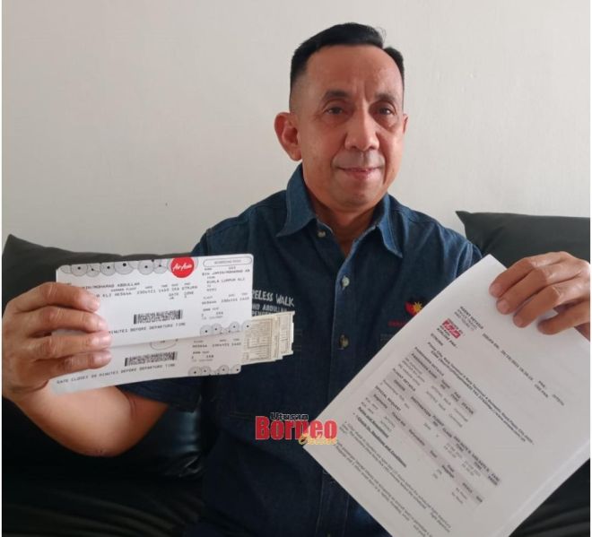 Mohamad menunjukkan tambang tiket RM2,000 seorang untuk beliau dan isteri, bagi penerbangan balik dari KL ke Miri, baru-baru ini.