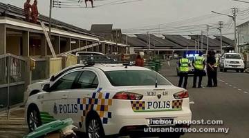 GEMPAR: Pihak bomba dan polis kelihatan berada di lokasi kejadian untuk menyelamat dan menahan lelaki berkenaan. 