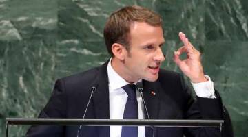 TEGAS: Macron berucap pada sesi ke-73 Perhimpunan Agung Pertubuhan Bangsa-Bangsa Bersatu (PBB) di Ibu Pejabat PBB di New York, Amerika Syarikat, kelmarin. — Gambar Reuters