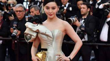 SKANDAL CUKAI: Gambar fail yang diambil pada 11 Mei 2018 ini menunjukkan aktres China Fan Bingbing semasa tiba untuk tayangan perdana filem ‘Ash is Purest White (Jiang hu er nv)’ di edisi ke- 71 Festival Filem Cannes di Cannes, selatan Perancis France. — Gambar AFP