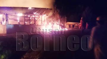 ANGGOTA bomba menjalankan operasi pemadaman terhadap salah sebuah rumah terbakar di Padas Valley pada Selasa.