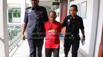 TANGGUH: Eddy dibawa keluar dari Mahkamah Tinggi selepas terus memilih untuk berdiam diri.