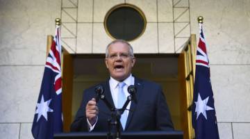 UMUM TARIKH PRU: Morrison mengumumkan 18 Mei sebagai tarikh pilihan raya umum ketika bercakap pada sidang akhbar di Dewan Parlimen di Canberra, Australia pada Khamis. — Gambar Reuters