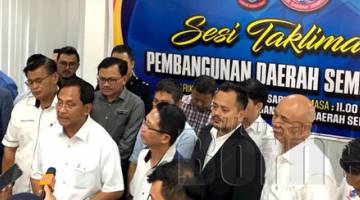 JAUJAN (tiga kiri) memberitahu para pemberita dengan Sesi Taklimat Pembangunan Daerah Semporna. turut sama Pegawai Daerah Semporna Bianus Kontong (empat kiri) dan Pengerusi Hatten Group Datuk Wira Eric Tan Eng Huat (kiri ).