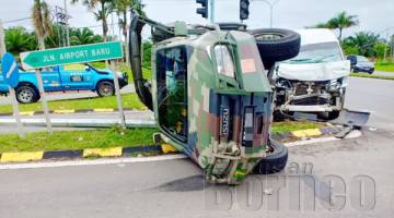 IMPAK kemalangan menyebabkan jip ATM terbalik di kawasan lampu isyarat Jalan Airport Baru Tawau.