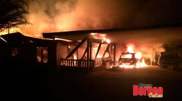TERBAKAR: Sebuah rumah dan dua kenderaan musnah terbakar.
