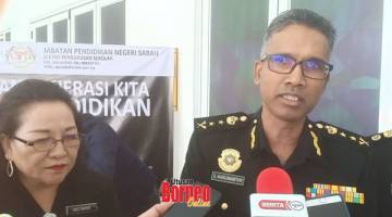 RASUAH: S Karunanithy memberitahu media mengenai kesalahan sering dilakukan di Jabatan Pendidikan Sabah (JPN) sambil diperhatikan oleh Pengarah JPN Sabah Dr. Mistirine Radin.