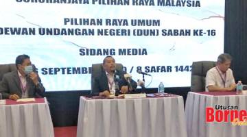 UMUM: Abd Ghani (tengah) mengumumkan keputusan rasmi PRN Sabah Ke-16.