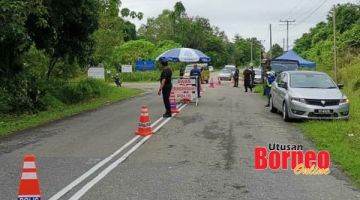 KAWALAN KETAT: Sekatan jalan ke Penempatan Masyarakat Pelarian Kiamsam.