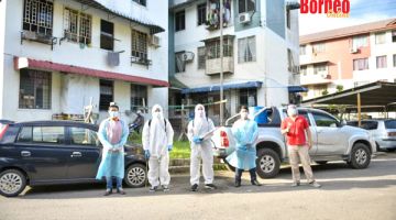 SANITASI: Pasukan DAP memulakan disinfeksi di Indah Jaya Apartment.