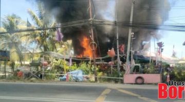 TERBAKAR: Api marak memusnahkan kedai bunga dan rumah di Kampung Tagas Jalan Tuaran di sini.