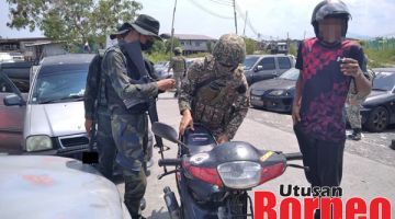 PERIKSA: Pasukan keselamatan menjalankan pemeriksaan ke atas motor tersebut dan suspek ditahan untuk siasatan lanjut.