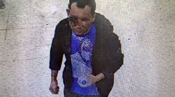 Rakaman CCTV yang dikeluarkan oleh Polis Metropolitan Britain kelmarin menunjukkan Abdul Shokkor Ezedi, di pasar raya Tesco di London pada Rabu lepas yang mengalami kecederaan serius di muka. — Gambar AFP