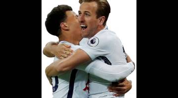 BERBISA: Kane (kanan) meraikan gol jaringan bersama rakan sepasukan pada perlawanan di Stadium Wembley. — Gambar AFP