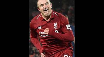 PRESTASI HEBAT: Shaqiri ceria selepas menjaringkan gol ketiga Liverpool pada perlawanan di Anfield, Liverpool kelmarin. — Gambar AFP