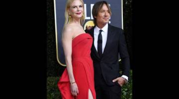 ANGGUN: Nicole Kidman dan suaminya, pemuzik Keith Urban. — Gambar AFP