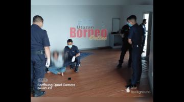 AMUK: Pasukan polis menenangkan suspek di surau LTAKK.